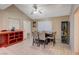 Dining area features tile floors, bright windows, and a ceiling fan at 4055 Planetary Ln, Las Vegas, NV 89115