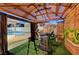 Backyard gazebo with a bar, seating, and a view of the pool, offering a relaxing outdoor entertainment space at 4055 Planetary Ln, Las Vegas, NV 89115