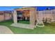 Outdoor gazebo with seating area and bar, perfect for entertaining in the backyard at 4055 Planetary Ln, Las Vegas, NV 89115