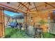 Charming backyard gazebo featuring a bar setup, seating and swing, ideal for relaxation and outdoor gatherings at 4055 Planetary Ln, Las Vegas, NV 89115