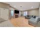 Bright living room featuring a fireplace, hardwood floors, and ample space for seating and entertaining at 4055 Planetary Ln, Las Vegas, NV 89115