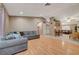 Spacious living room featuring hardwood floors, neutral paint, and an open layout leading to the dining area at 4055 Planetary Ln, Las Vegas, NV 89115