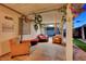 Cozy, covered patio with comfortable seating, decor, and lighting; great for relaxing near the backyard at 4055 Planetary Ln, Las Vegas, NV 89115