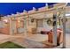 A covered patio featuring ample seating and charming decor, perfect for relaxation and entertainment at 4055 Planetary Ln, Las Vegas, NV 89115