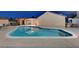 Large backyard pool provides an inviting space for relaxation and outdoor fun on a sunny day at 4055 Planetary Ln, Las Vegas, NV 89115