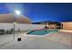 Night view of a private backyard pool with stamped concrete patio at 4055 Planetary Ln, Las Vegas, NV 89115