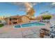 Sparkling pool surrounded by a spacious patio, perfect for outdoor enjoyment and relaxation under the sun at 4055 Planetary Ln, Las Vegas, NV 89115