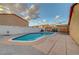 Backyard featuring a pool, surrounded by a patio and a wall; ready for entertaining or relaxation at 4055 Planetary Ln, Las Vegas, NV 89115
