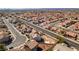 This aerial shot displays a charming residential community with tree-lined roads, beautiful homes, and serene surroundings at 4141 Coburn St, North Las Vegas, NV 89032