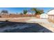 Spacious backyard with a concrete pad, blank canvas ready to be landscaped to your desire at 4141 Coburn St, North Las Vegas, NV 89032