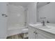 This bathroom features vinyl flooring, a tub and shower, and a large mirror at 4141 Coburn St, North Las Vegas, NV 89032