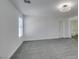 This bedroom has neutral carpet, a ceiling fan, and a doorway to the bathroom at 4141 Coburn St, North Las Vegas, NV 89032