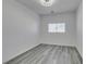 Bedroom featuring wood-look floors, horizontal blinds, and natural light at 4141 Coburn St, North Las Vegas, NV 89032