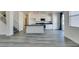 Bright kitchen featuring stainless steel appliances, granite counters, and wood-style flooring at 4141 Coburn St, North Las Vegas, NV 89032