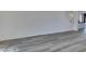 Open living room with light wood-look floors, neutral paint, and staircase view at 4141 Coburn St, North Las Vegas, NV 89032