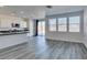 Open-concept living area with view of the kitchen and yard at 4141 Coburn St, North Las Vegas, NV 89032