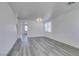 Bright living room featuring sleek wood-look floors and modern lighting at 4141 Coburn St, North Las Vegas, NV 89032