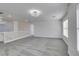 Bright loft area with neutral carpet, modern light fixture, and white walls offering a versatile living space at 4141 Coburn St, North Las Vegas, NV 89032