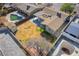 An aerial view of the backyard featuring a combination of lawn, shed, patio, mature trees and pool at 4258 E Twain Ave, Las Vegas, NV 89121