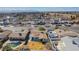 An aerial view of a residential area, featuring tidy homes, mature trees, and blue sky, emphasizing the neighborhood's peaceful setting at 4258 E Twain Ave, Las Vegas, NV 89121