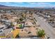 Aerial view of homes featuring spacious backyards, mature palm trees, and lush landscaping in a quiet residential neighborhood at 4258 E Twain Ave, Las Vegas, NV 89121