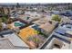 Aerial shot showcasing backyard with pool, shed, large grassy area, surrounded by trees and privacy fencing at 4258 E Twain Ave, Las Vegas, NV 89121