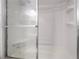 Close-up of a shower featuring built-in shelves and a sliding glass door at 4258 E Twain Ave, Las Vegas, NV 89121