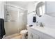 Bright bathroom with a decorative glass shower door and a round mirror at 4258 E Twain Ave, Las Vegas, NV 89121