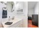 Bright bathroom featuring a large mirror, and a light wood stained vanity at 4258 E Twain Ave, Las Vegas, NV 89121