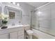 Well-lit bathroom featuring a shower-tub combo, white vanity, and stylish mirror at 4258 E Twain Ave, Las Vegas, NV 89121