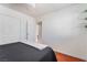 Comfortable bedroom features a closet and doorway that leads to a tiled space at 4258 E Twain Ave, Las Vegas, NV 89121