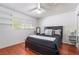 Cozy bedroom showcasing sleek, modern furnishings, a well-lit window, and stylish glass shelving at 4258 E Twain Ave, Las Vegas, NV 89121