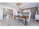 Spacious dining room featuring neutral walls, modern light fixtures, and tile floors, providing a sophisticated dining experience at 4258 E Twain Ave, Las Vegas, NV 89121