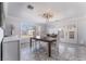 Elegant dining room boasts stylish lighting, ample natural light, and a spacious layout, perfect for entertaining guests at 4258 E Twain Ave, Las Vegas, NV 89121