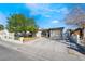 Well-maintained single-story home featuring a manicured lawn and convenient driveway access to the attached garage at 4258 E Twain Ave, Las Vegas, NV 89121