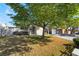 Charming single-story home with a large tree, offering shade and curb appeal with a well-kept lawn at 4258 E Twain Ave, Las Vegas, NV 89121