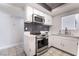 Fully equipped kitchen with stainless steel appliances, sleek countertops, and backsplash; a chef's delight at 4258 E Twain Ave, Las Vegas, NV 89121