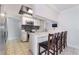 Modern kitchen features white cabinets, stainless steel appliances, and a stylish backsplash, perfect for culinary enthusiasts at 4258 E Twain Ave, Las Vegas, NV 89121