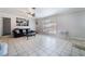 Inviting living room with neutral tile flooring and a large window, creating a bright and airy ambiance at 4258 E Twain Ave, Las Vegas, NV 89121