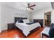 Cozy bedroom with hardwood floors, ceiling fan, and ample natural light, perfect for restful nights at 4258 E Twain Ave, Las Vegas, NV 89121