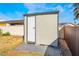 Backyard shed features a single door and neutral color scheme at 4258 E Twain Ave, Las Vegas, NV 89121