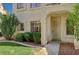 Inviting entryway with security door, lush lawn and garden with walkway to the front door at 4718 Nara Vista Way # 101, Las Vegas, NV 89103