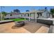Spacious backyard with a patio, fire pit, and grill, ideal for entertaining at 4804 El Tesoro Ave, Las Vegas, NV 89121