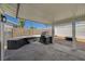 Covered backyard patio with a grill at 4804 El Tesoro Ave, Las Vegas, NV 89121