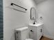 Modern bathroom with a toilet, vanity, and matte black fixtures at 4804 El Tesoro Ave, Las Vegas, NV 89121