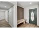 Hallway with storage bench and paneled wall at 4804 El Tesoro Ave, Las Vegas, NV 89121