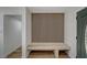 Inviting entryway with wood floors, a bench, and storage hooks at 4804 El Tesoro Ave, Las Vegas, NV 89121