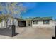 A cozy single-story home with a well-manicured lawn, a black brick accent wall, and a garage at 4804 El Tesoro Ave, Las Vegas, NV 89121