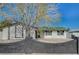 Charming single-story home with a well-maintained front yard and a brick accent wall at 4804 El Tesoro Ave, Las Vegas, NV 89121
