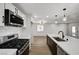 Modern kitchen featuring stainless steel appliances, white countertops, and pendant lighting at 4804 El Tesoro Ave, Las Vegas, NV 89121